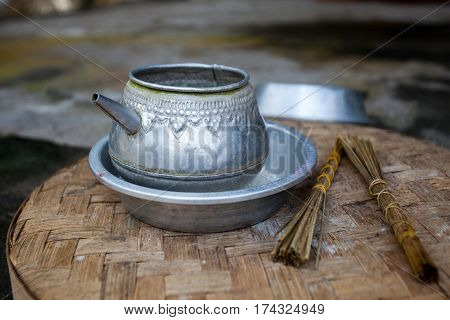 Traditional old aluminum kettle and incense for ceremonies in the temple. Indonesia Bali