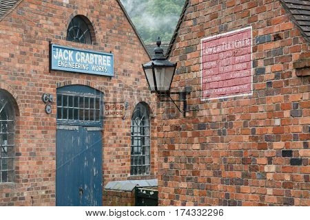 IRONBRIDGE UK - CIRCA 2013: Exterior of red brick workshops at Blists Hill Victorian Museum Ironbridge Shropshire UK