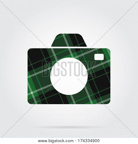green black isolated tartan icon with white stripes - camera and shadow in front of a gray background