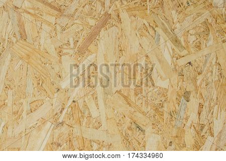 abstract background texture of Wood chips felted brown color (OSB)