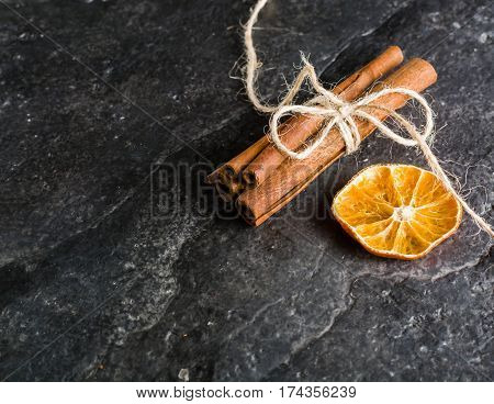 Dry Slices Of Citrus Fruits On A Black Slate Background.