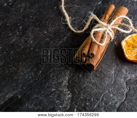Dry Slices Of Citrus Fruits On A Black Slate Background.