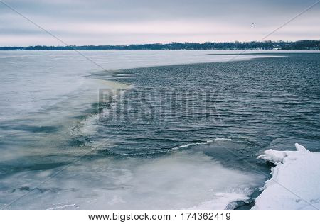 Old film stylized landscape with of Dnepr river at January in Dnepr city Ukraine