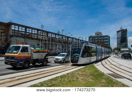 Rio de Janeiro, Brazil - February 10, 2017: VLT tram is passing in the street along with cars in traffic.