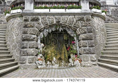 RAPPERSWIL SWITZERLAND - MAY 10 2016: Fountain in the form of the cave it is decoration of the stairway leading from the city square to the castle