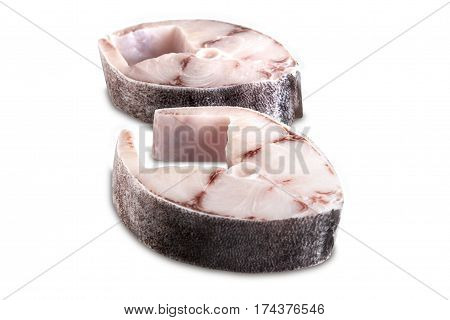 Two steaks of cobia on a white background