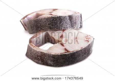 Two steaks of cobia on a white background