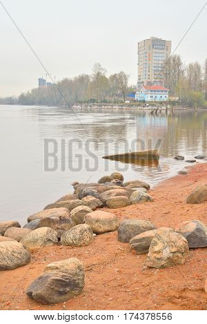 View of Neva River on the outskirts of St. Petersburg on a cloudy spring day in Russia.