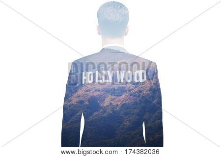 Back view of thoughtful young businessman daydreaming about Hollywood. Cinematography and fame concept. Double exposure