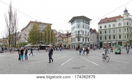 LJUBLJANA SLOVENIA - OCTOBER 13: Pedestrians at Preseren Square in Ljubljana on OCTOBER 13 2014. People Walking at Pedestrian Zone in Ljubljana Slovenia.