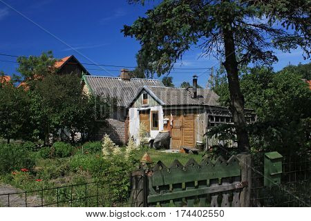 Old building in the Morskoe (Pillkoppen) village in the Curonian Spit National Park. Russia.