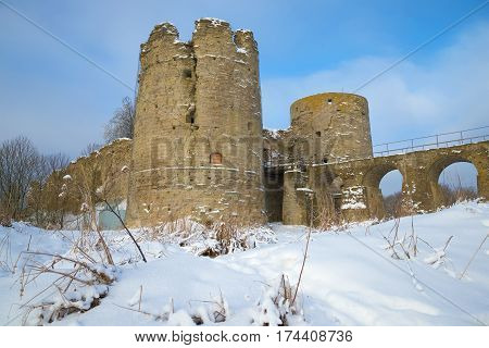 At the bottom of medieval Koporye fortress in the February afternoon. Leningrad region, Russia