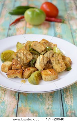 Stir fried tofu with green tomato and chili or Oseng Tahu, Indonesian food