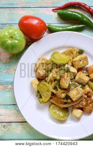 Stir fried tofu with green tomato and chili or Oseng Tahu, Indonesian food