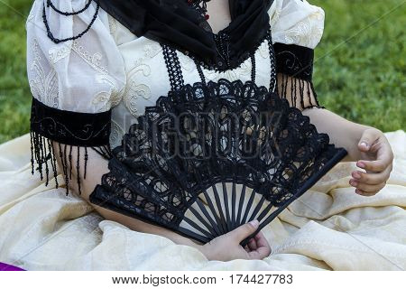 CAGLIARI, ITALY - May 29, 2016: Sunday at La Grande Jatte VIII Ed. At the Public Gardens - detail of a custom in Victorian style - Sardinia