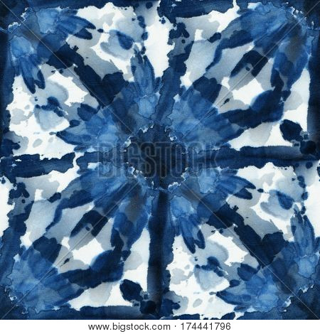 Seamless tie-dye pattern of indigo color on white silk. Hand painting fabrics - nodular batik. Shibori dyeing.