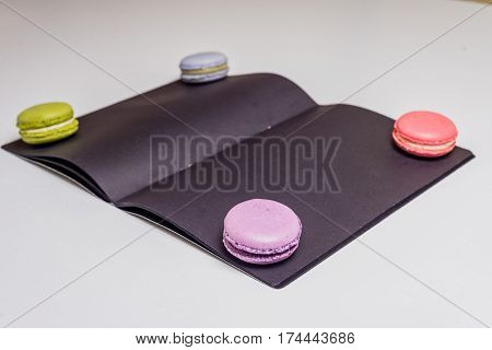 French Macaronsons On Black Paper