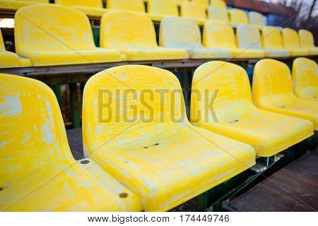 Old Yellow Seat In Stadium Closeup