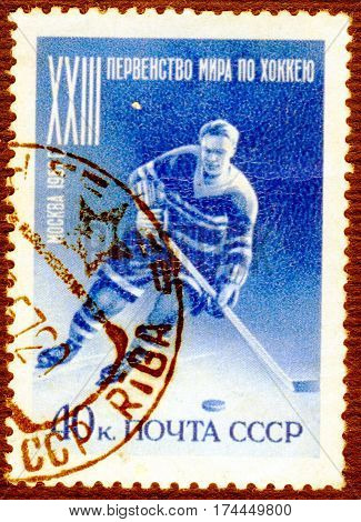 USSR - CIRCA 1957: Postage stamp printed in USSR  with a picture of a hockey player, with the inscription 