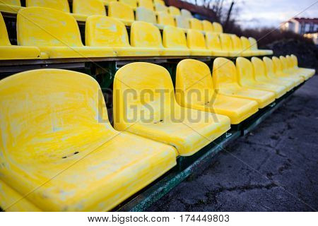 Old Yellow Seat In Stadium Closeup