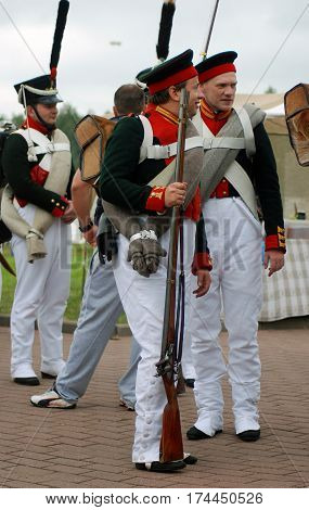 BORODINO MOSCOW REGION - SEPTEMBER 04 2016: Reenactors dressed as Napoleonic war soldiers at Borodino battle historical reenactment in Russia. Color photo.