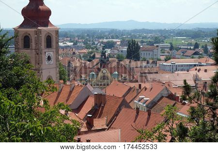 PTUJ, SLOVENIA - JULY 02: Roofs of old city center and Saint George church in Ptuj, town on the Drava River banks, Lower Styria Region, Slovenia on July 02, 2016.