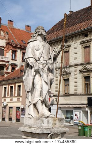 MARIBOR, SLOVENIA - APRIL 03: Saint Roch statue, Plague column at Main Square of the city of Maribor in Slovenia, Europe. Historical religious sculpture, April 03, 2016.