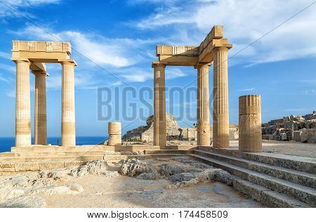 Landscape with ancient Roman time columns at Lindos in Greece.