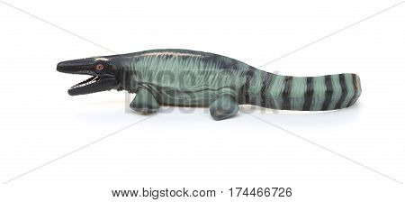 side view Mosasaurus toy with shadow on white background