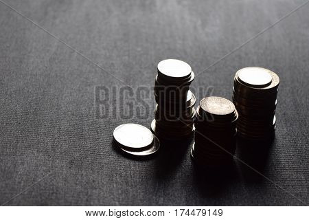 A Coin stacks in black canvas background.