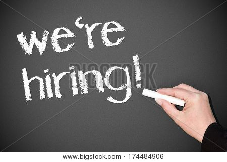 we're hiring - female hand writing text