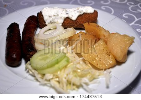 Beautifully decorated with the white plate of homemade dishes. Kara