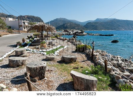 Seaside coastline decorated with art objects at Paleochora town on Crete island, Greece