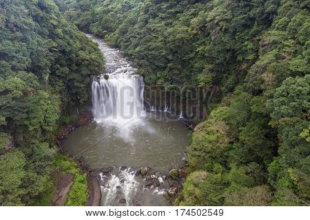 Kamikawa Otaki Waterfall And Green Forest In Kagoshima, Kyushu, Japan
