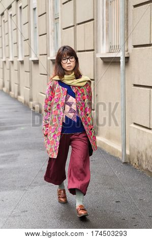 MILAN ITALY - FEBRUARY 23: Fashionable woman poses outside Les Copains fashion show during Milan Women's Fashion Week on FEBRUARY 23 2017 in Milan.