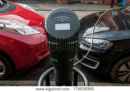 electric car charging to refuel at the charging station