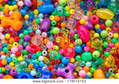 Lots of colorful fusible plastic beads used for arts and craft
