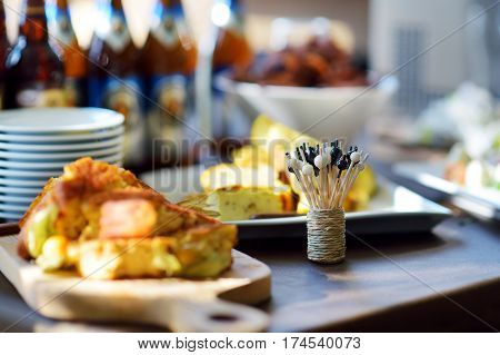 Different Kinds Of Wine Snacks And Variuos Cheeses On A Table