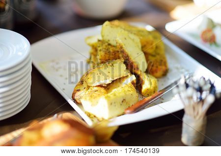 Different Kinds Of Wine Snacks And Variuos Cheeses On A Table