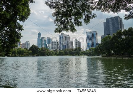 Bangkok Thailand - september 04 2016: evening scene of Bangkok skyline at Lumphini Park in Bangkok. Lumphini Park is a park in Bangkok