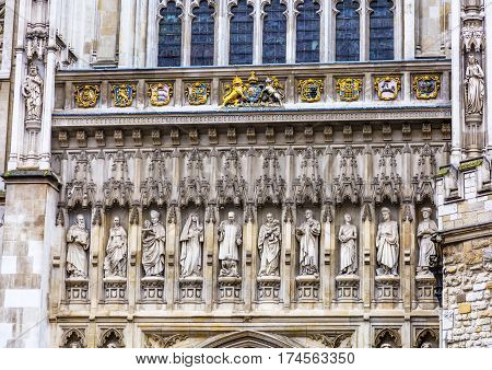 LONDON, ENGLAN - JANUARY 16, 2017  Christian Martyr Statues Above Door Facade Westminster Abbey Church London England. Statues include Martin Luther King/USA and Wang Zhiming/China. Decidcated June 9 1998.