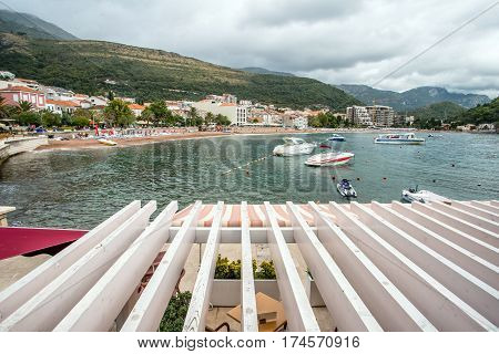 PETROVAC, MONTENEGRO - SEPTEMBER 20, 2016:Bay of Petrovac with boats and pier, Montenegro.