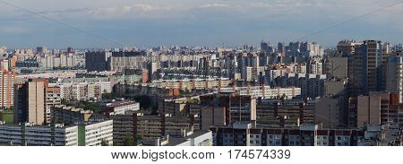 Panorama of a city block with high multi-storey apartment buildings the area of the big city from a height.