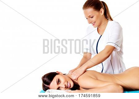 Woman having massage of body in the spa salon. Beauty treatment concept.