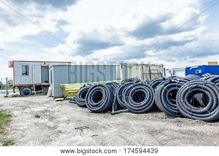 Makeshift storage material HDPE and PVC pipe for different usage at construction site in the improvised warehouse.