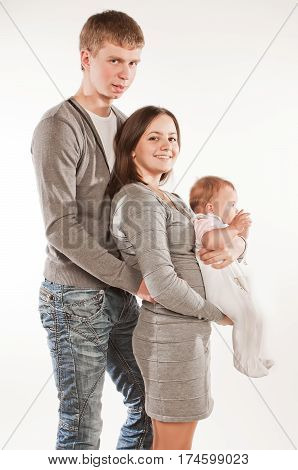Happy family with child posing on white background family