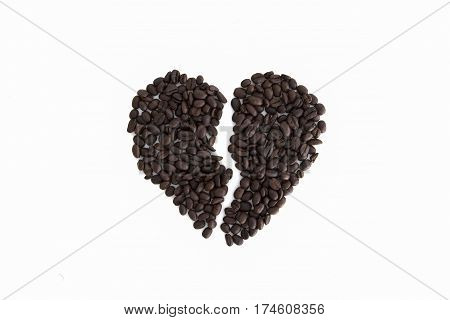 broken heart from coffee beans isolated on a white background