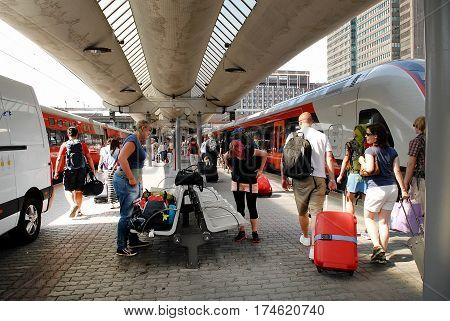 Oslo Norway - July 22 2014: Unidentified passengers at the central railway station of Oslo also called 