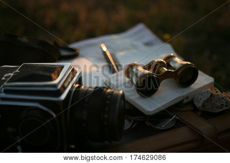 vintage pearl operaglasses and notepads in the sunset light