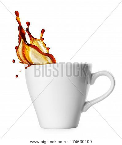 small classical white cup of coffee espresso with splash isolated on white background. Coffee splash from a cup